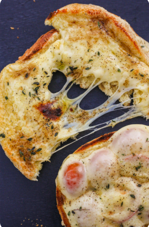 Close-up of a baked pizza with stretchy, well-melted plant-based cheese